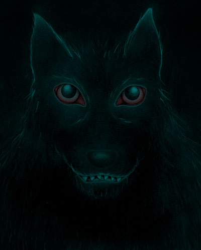 Black doglike creature bathed in darkness, with ears, eyes, and smiling mouth having a faint green glow