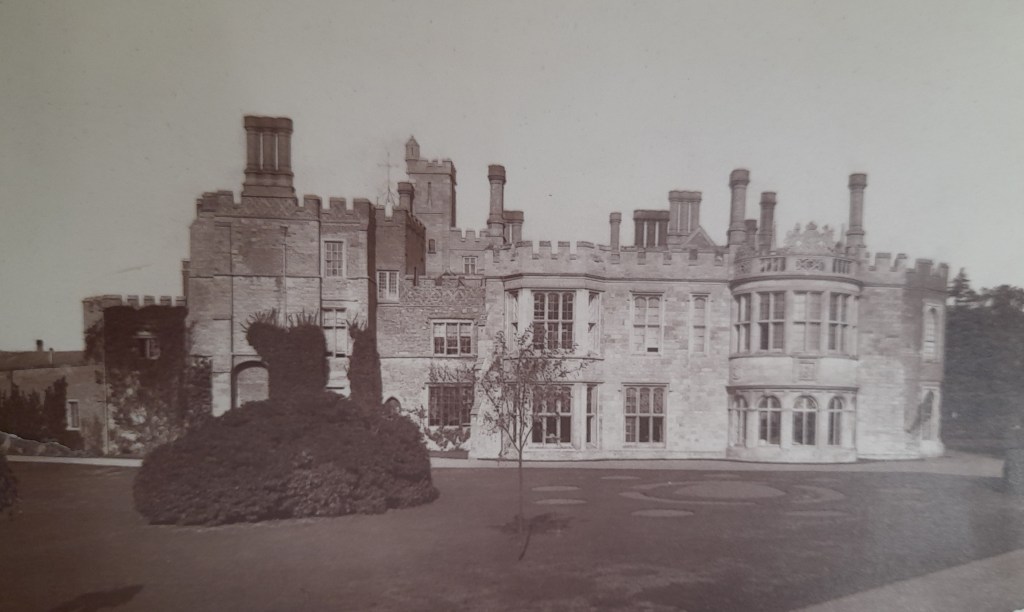 Black and white photo of an old stately home