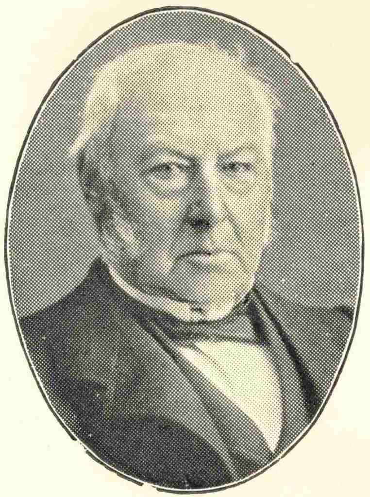 Victorian or Edwardian photo of a well-dressed man with large sideburns