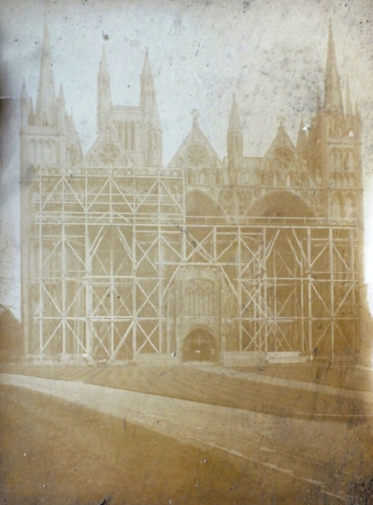 Photo of a cathedral facade covered in scaffolding